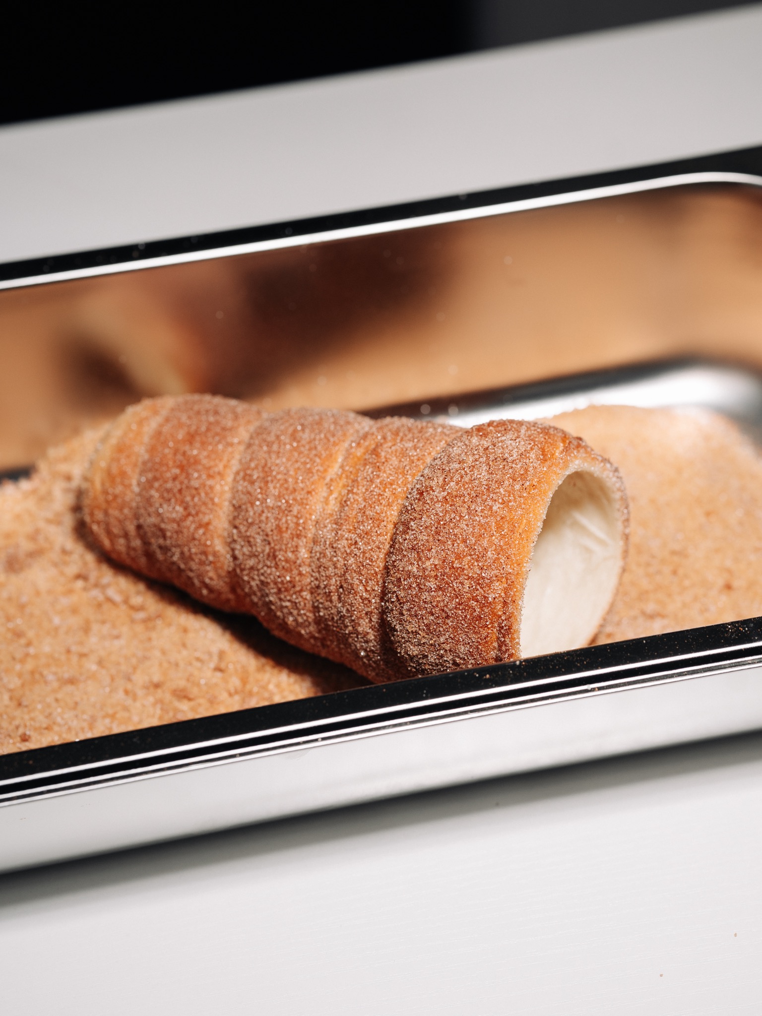 Fresh chimney cake rolled in cinnamon sugar